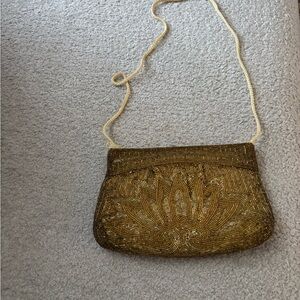 Elegant Gold Beaded Clutch